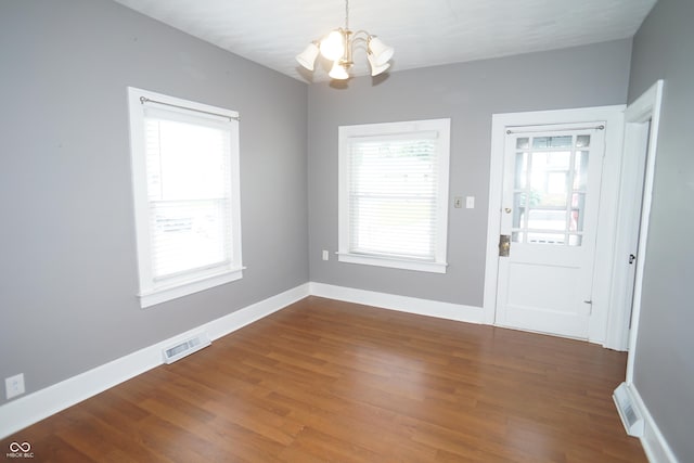 524 Hoene Ave, Batesville, IN 47006 - foyer entrance featuring a chandelier, plenty of natural light, dark wood-style flooring, and baseboards