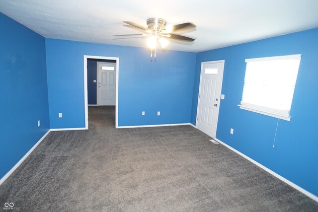 524 Hoene Ave, Batesville, IN 47006 - unfurnished room with a ceiling fan, dark carpet, and baseboards