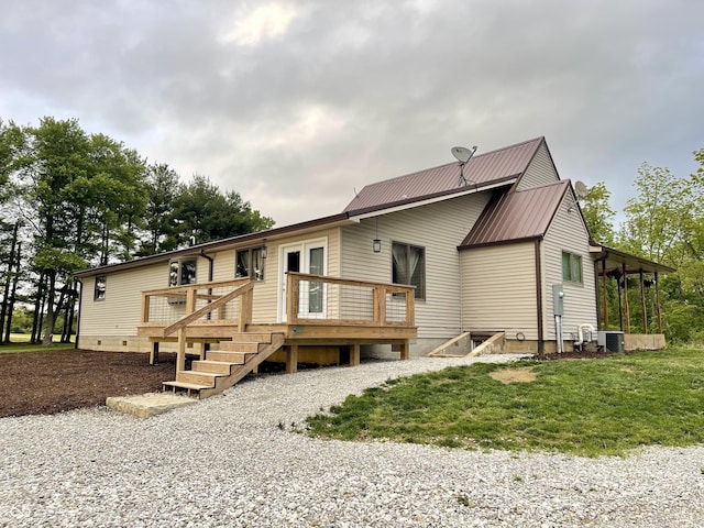 6593 N 800 W, Elwood, IN 46036 - rear view of property with a deck, metal roof, central AC unit, and crawl space