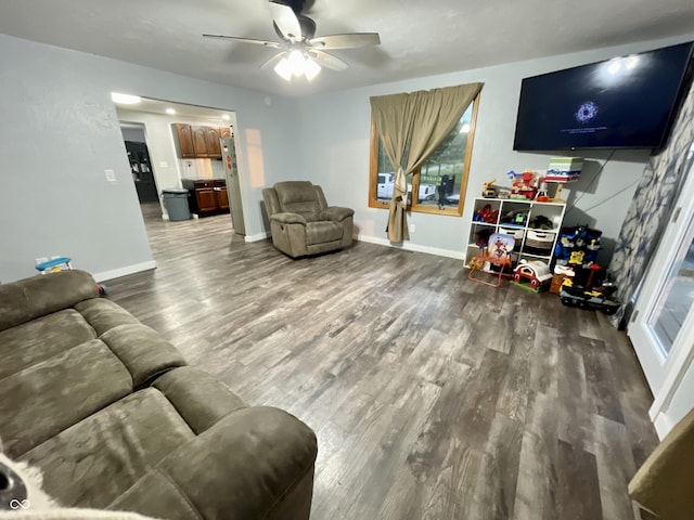 6593 N 800 W, Elwood, IN 46036 - living room with wood finished floors, ceiling fan, and baseboards