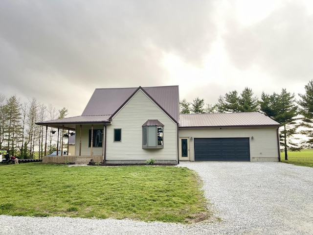 6593 N 800 W, Elwood, IN 46036 - view of front facade featuring gravel driveway, a porch, a front yard, and metal roof
