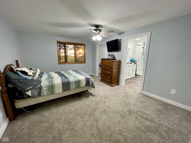 6593 N 800 W, Elwood, IN 46036 - carpeted bedroom with baseboards, ceiling fan, and ensuite bathroom