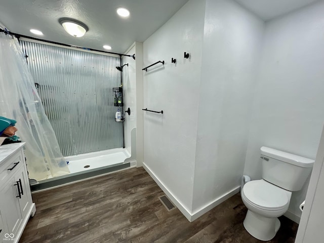 6593 N 800 W, Elwood, IN 46036 - bathroom featuring toilet, a stall shower, wood finished floors, vanity, and baseboards