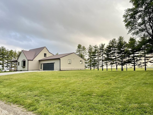 6593 N 800 W, Elwood, IN 46036 - view of property exterior featuring an attached garage, a yard, and driveway
