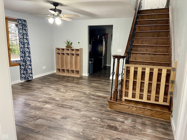 6593 N 800 W, Elwood, IN 46036 - interior space with wood finished floors, stairs, ceiling fan, and baseboards