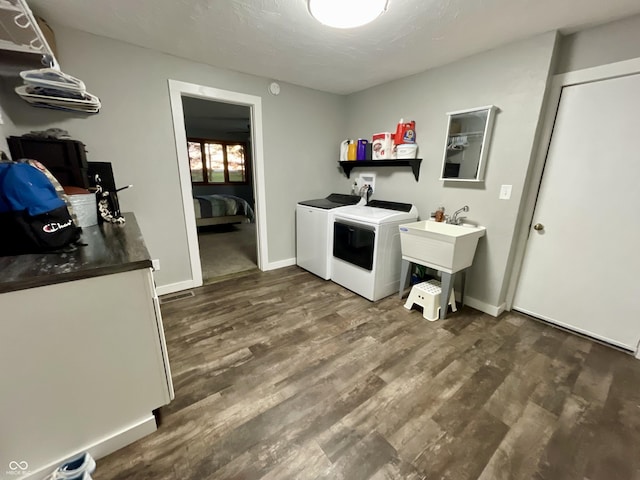 6593 N 800 W, Elwood, IN 46036 - laundry area featuring independent washer and dryer, dark wood-style flooring, and baseboards