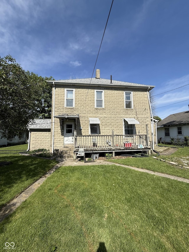 2310 Noble St, Anderson, IN 46016 - rear view of house with a yard, a deck, and a chimney
