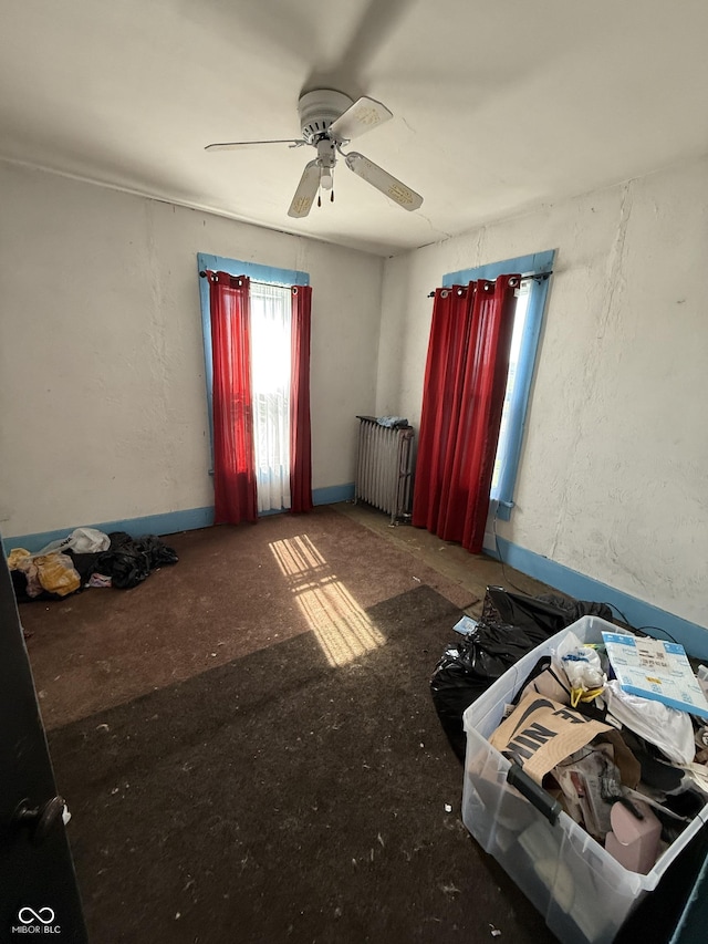 2310 Noble St, Anderson, IN 46016 - unfurnished bedroom with radiator heating unit and ceiling fan