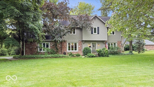 13297 Highland Springs Dr, Mccordsville, IN 46055 - view of front of property with a front yard and brick siding
