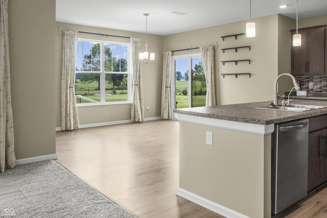 9018 E Gayle Dr, Morgantown, IN 46160 - kitchen featuring stainless steel dishwasher, wood finished floors, dark countertops, dark brown cabinets, and pendant lighting