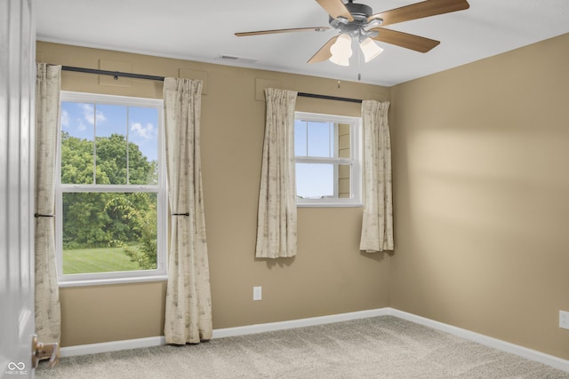 9018 E Gayle Dr, Morgantown, IN 46160 - empty room featuring healthy amount of natural light, carpet floors, and a ceiling fan