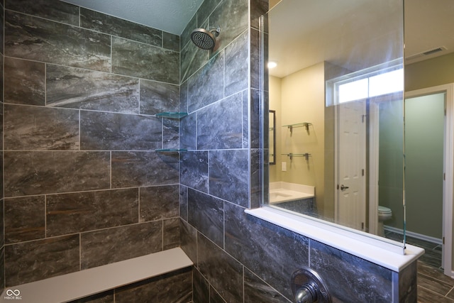 9018 E Gayle Dr, Morgantown, IN 46160 - bathroom featuring a tile shower and toilet