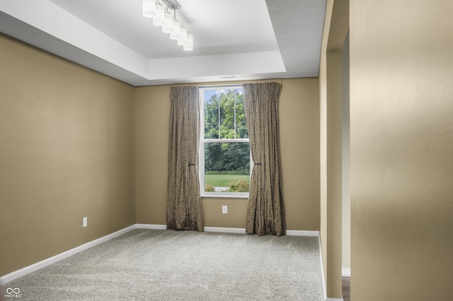 9018 E Gayle Dr, Morgantown, IN 46160 - carpeted spare room featuring a tray ceiling and baseboards