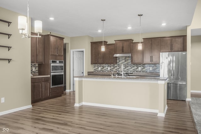 9018 E Gayle Dr, Morgantown, IN 46160 - kitchen featuring stainless steel appliances, backsplash, wood finished floors, under cabinet range hood, and recessed lighting