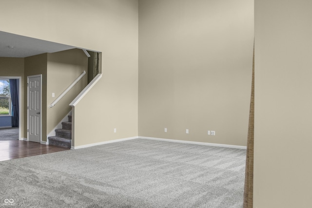 9018 E Gayle Dr, Morgantown, IN 46160 - empty room featuring dark carpet and stairs