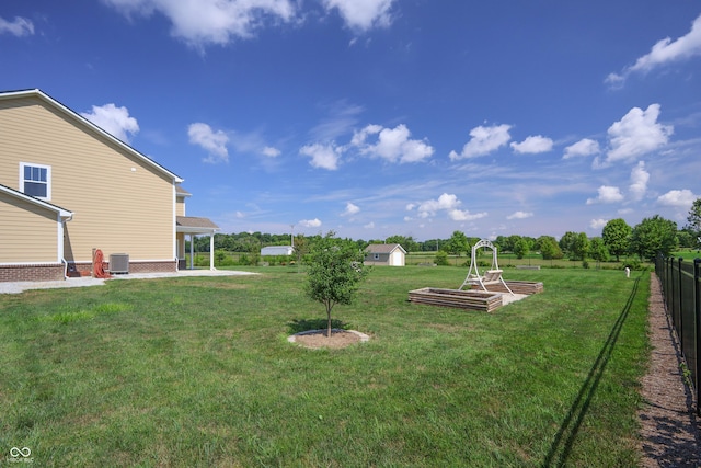 9018 E Gayle Dr, Morgantown, IN 46160 - view of yard featuring a patio area and a storage unit