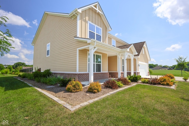 9018 E Gayle Dr, Morgantown, IN 46160 - view of side of property featuring a porch, brick siding, a lawn, and board and batten siding