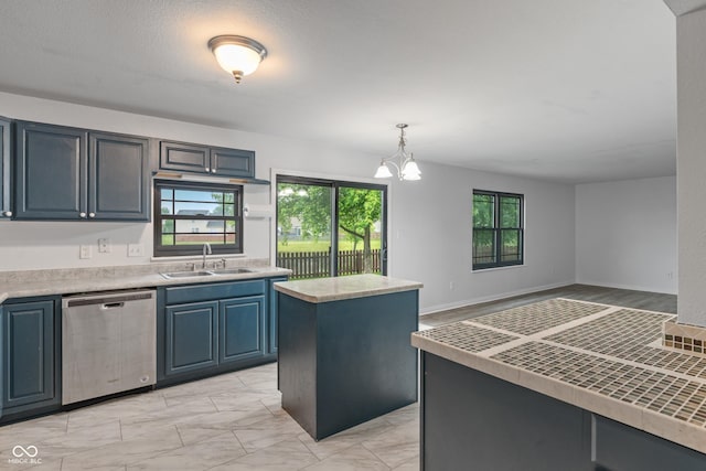 1408 Snead Cir, Avon, IN 46123 - kitchen with dishwasher, a sink, a chandelier, blue cabinets, and pendant lighting