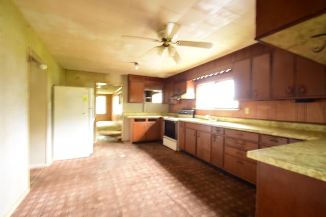 10577 Dalton Rd, Hagerstown, IN 47346 - kitchen with electric stove, light countertops, ceiling fan, tile patterned floors, and brown cabinets