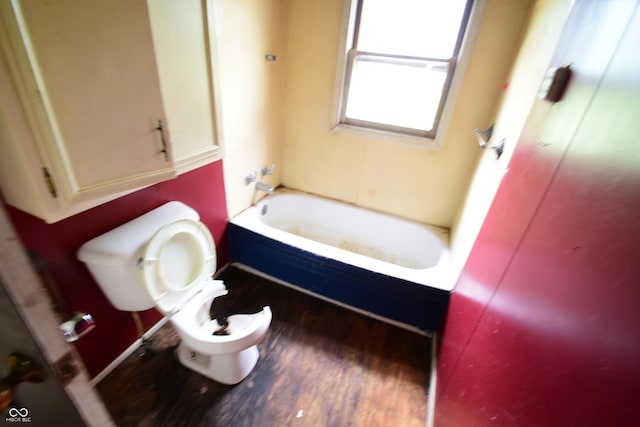 10577 Dalton Rd, Hagerstown, IN 47346 - bathroom with toilet, wood finished floors, and shower / washtub combination