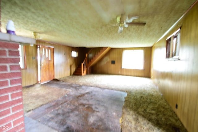 10577 Dalton Rd, Hagerstown, IN 47346 - bonus room featuring wood walls, ceiling fan, carpet, and stairway