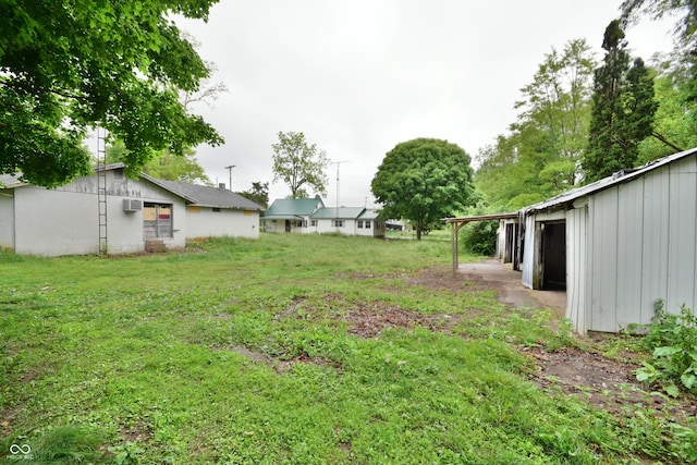 10577 Dalton Rd, Hagerstown, IN 47346 - view of grassy yard featuring an AC wall unit