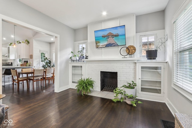 923 42nd St, Indianapolis, IN 46205 - living area featuring wood finished floors and a fireplace