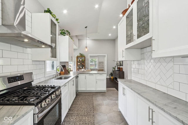 923 42nd St, Indianapolis, IN 46205 - kitchen featuring stainless steel appliances, wall chimney exhaust hood, light stone countertops, white cabinetry, and recessed lighting