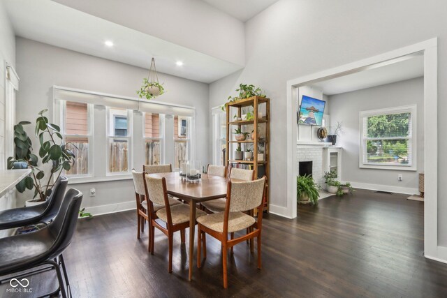 923 42nd St, Indianapolis, IN 46205 - dining area featuring dark wood finished floors, a fireplace, and recessed lighting