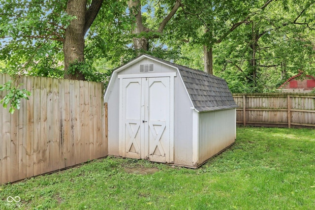 923 42nd St, Indianapolis, IN 46205 - view of shed with a fenced backyard and view of wooded area