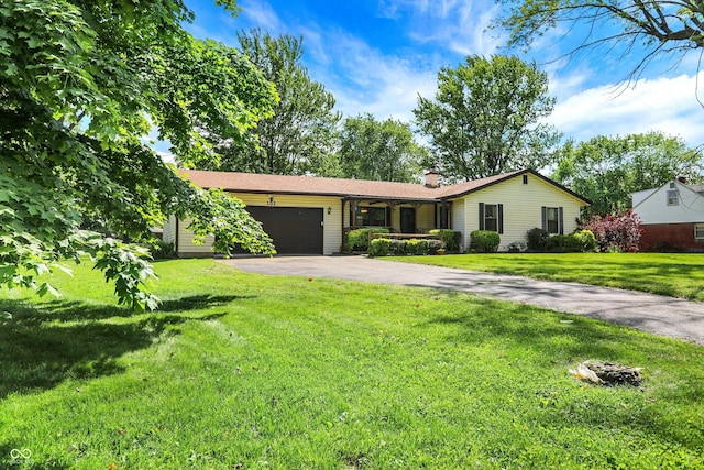 101 Heiny Rd, Indianapolis, IN 46217 - ranch-style home featuring driveway, an attached garage, a chimney, and a front yard