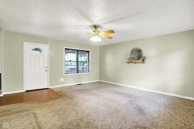 101 Heiny Rd, Indianapolis, IN 46217 - carpeted foyer with ceiling fan, a textured ceiling, and baseboards