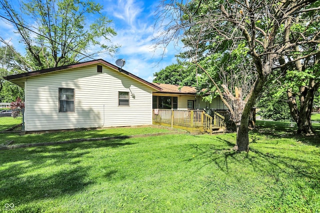 101 Heiny Rd, Indianapolis, IN 46217 - rear view of property with a lawn and a wooden deck