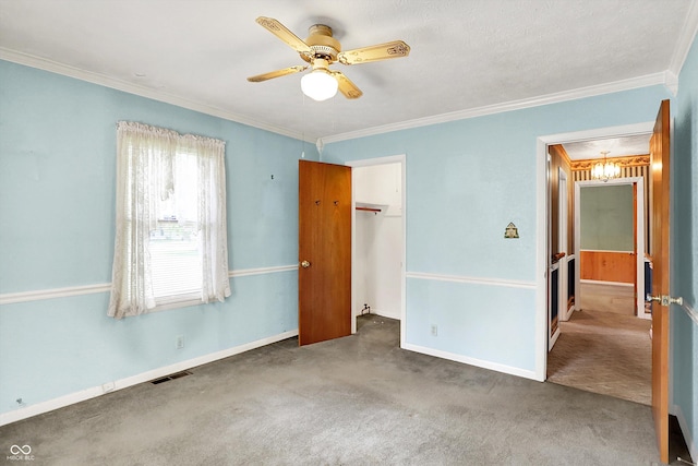 101 Heiny Rd, Indianapolis, IN 46217 - unfurnished bedroom with carpet, ornamental molding, baseboards, a closet, and a ceiling fan