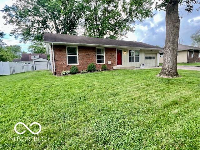 1834 Chandler Ln, Columbus, IN 47203 - ranch-style home featuring a garage and brick siding