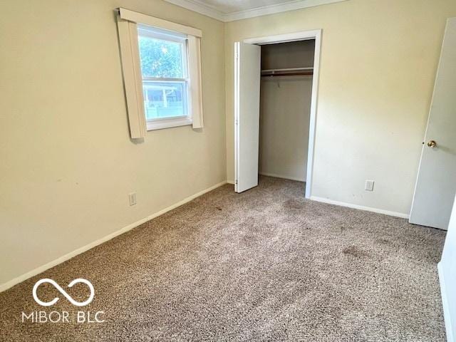 1834 Chandler Ln, Columbus, IN 47203 - unfurnished bedroom featuring carpet floors, ornamental molding, baseboards, and a closet