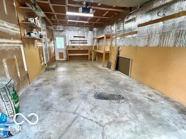 1834 Chandler Ln, Columbus, IN 47203 - garage featuring a garage door opener