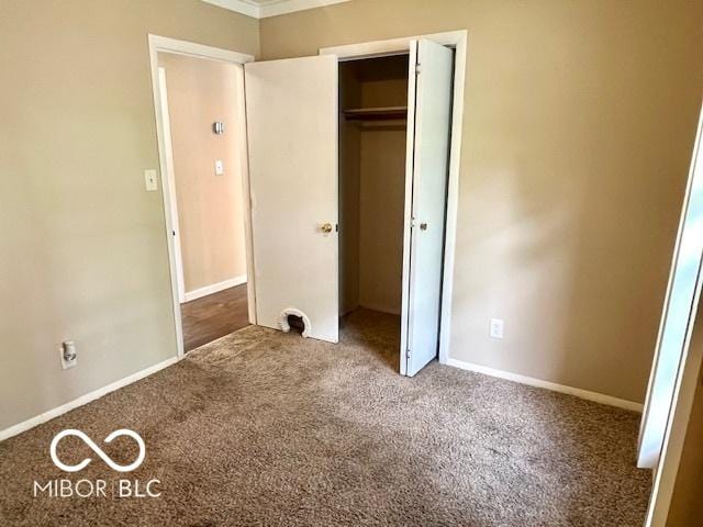 1834 Chandler Ln, Columbus, IN 47203 - unfurnished bedroom featuring carpet flooring, a closet, and baseboards