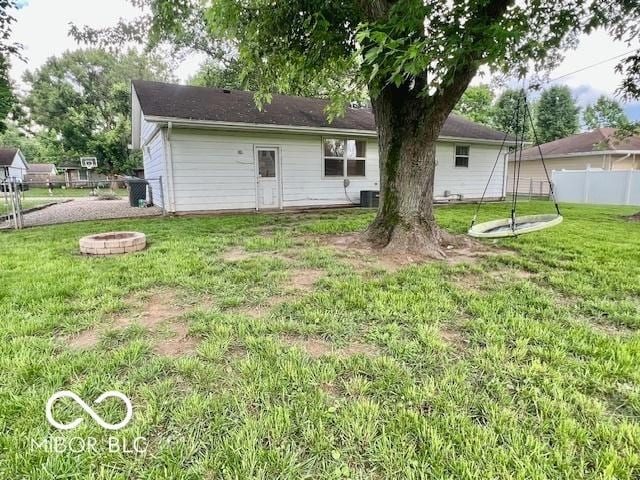 1834 Chandler Ln, Columbus, IN 47203 - rear view of property featuring a fire pit and cooling unit