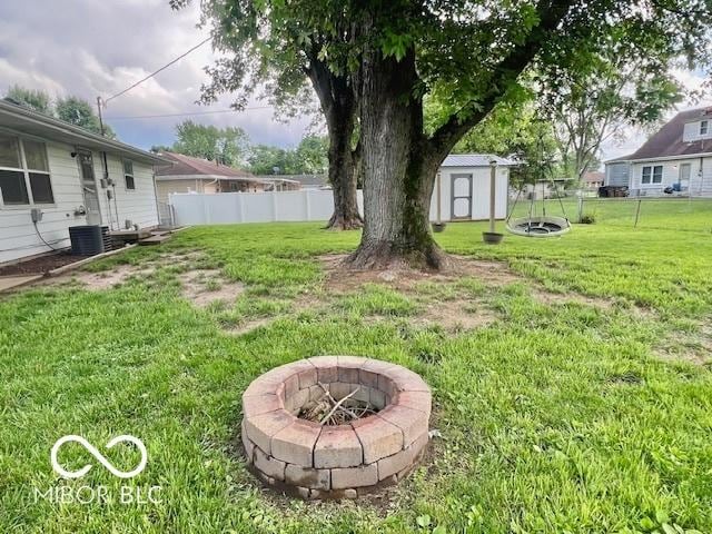 1834 Chandler Ln, Columbus, IN 47203 - view of yard featuring an outdoor fire pit and central AC unit