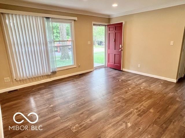 1834 Chandler Ln, Columbus, IN 47203 - empty room with ornamental molding, baseboards, and dark wood-style floors