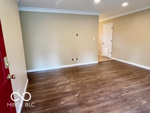 1834 Chandler Ln, Columbus, IN 47203 - spare room with crown molding, baseboards, wood finished floors, and recessed lighting