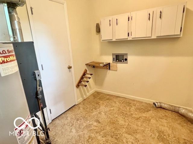 1834 Chandler Ln, Columbus, IN 47203 - laundry room featuring cabinet space, hookup for a washing machine, light colored carpet, and baseboards