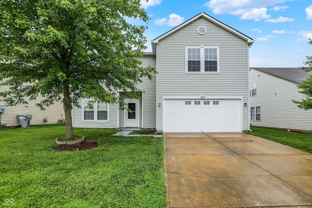 630 Harmony Way, Greenwood, IN 46143 - traditional-style home with a garage, concrete driveway, and a front yard