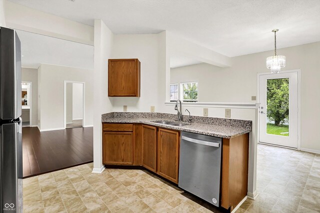 630 Harmony Way, Greenwood, IN 46143 - kitchen featuring stainless steel appliances, a sink, brown cabinetry, light stone counters, and baseboards