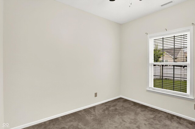 630 Harmony Way, Greenwood, IN 46143 - spare room featuring baseboards, dark carpet, and ceiling fan