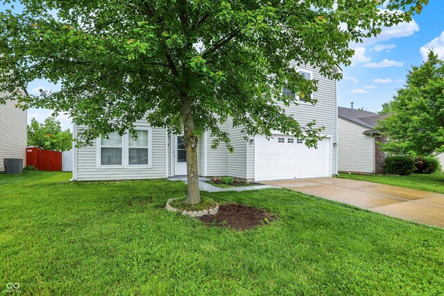 630 Harmony Way, Greenwood, IN 46143 - view of property hidden behind natural elements featuring concrete driveway, cooling unit, and an attached garage