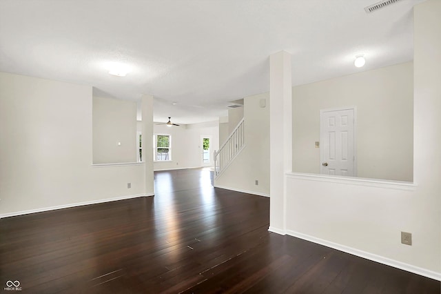 630 Harmony Way, Greenwood, IN 46143 - unfurnished room featuring stairway, dark wood-style floors, a ceiling fan, and baseboards