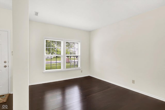 630 Harmony Way, Greenwood, IN 46143 - empty room featuring dark wood-style flooring and baseboards