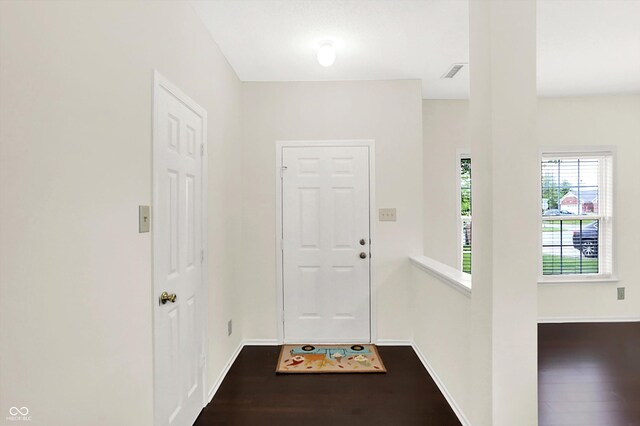 630 Harmony Way, Greenwood, IN 46143 - entryway with dark wood-type flooring and baseboards